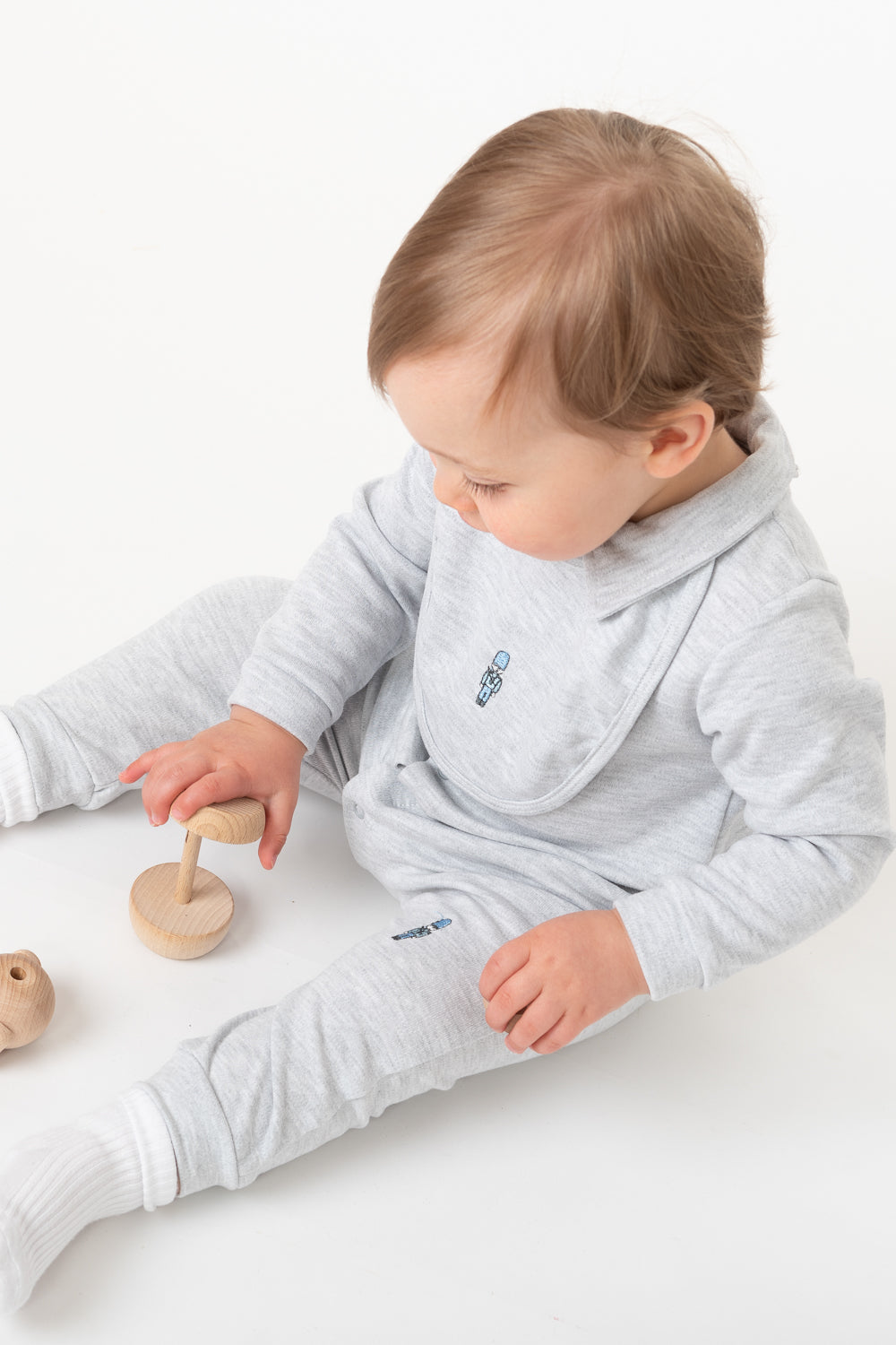 Grey Baby Romper with Embroidered Soldiers and Matching Bib