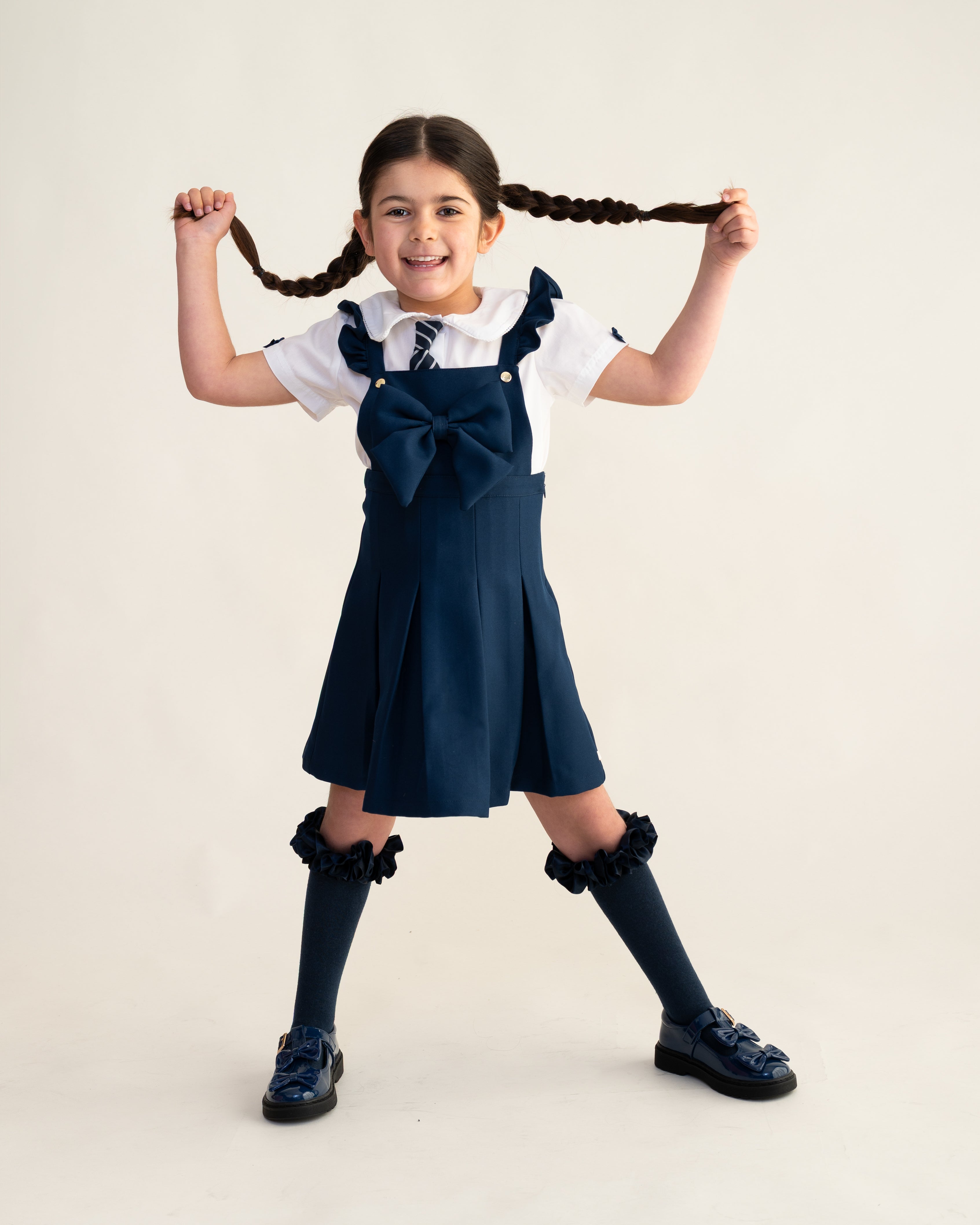 Navy Frill Pinafore School Dress with Bow