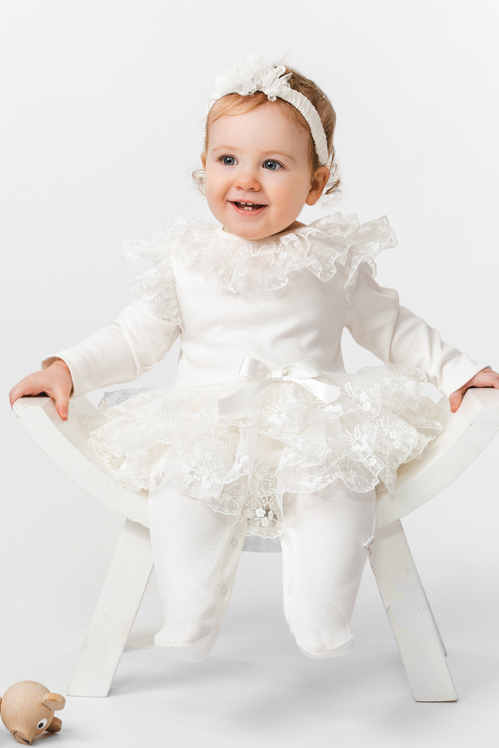 Ivory Baby Romper with Lace Overlay and Satin Bow