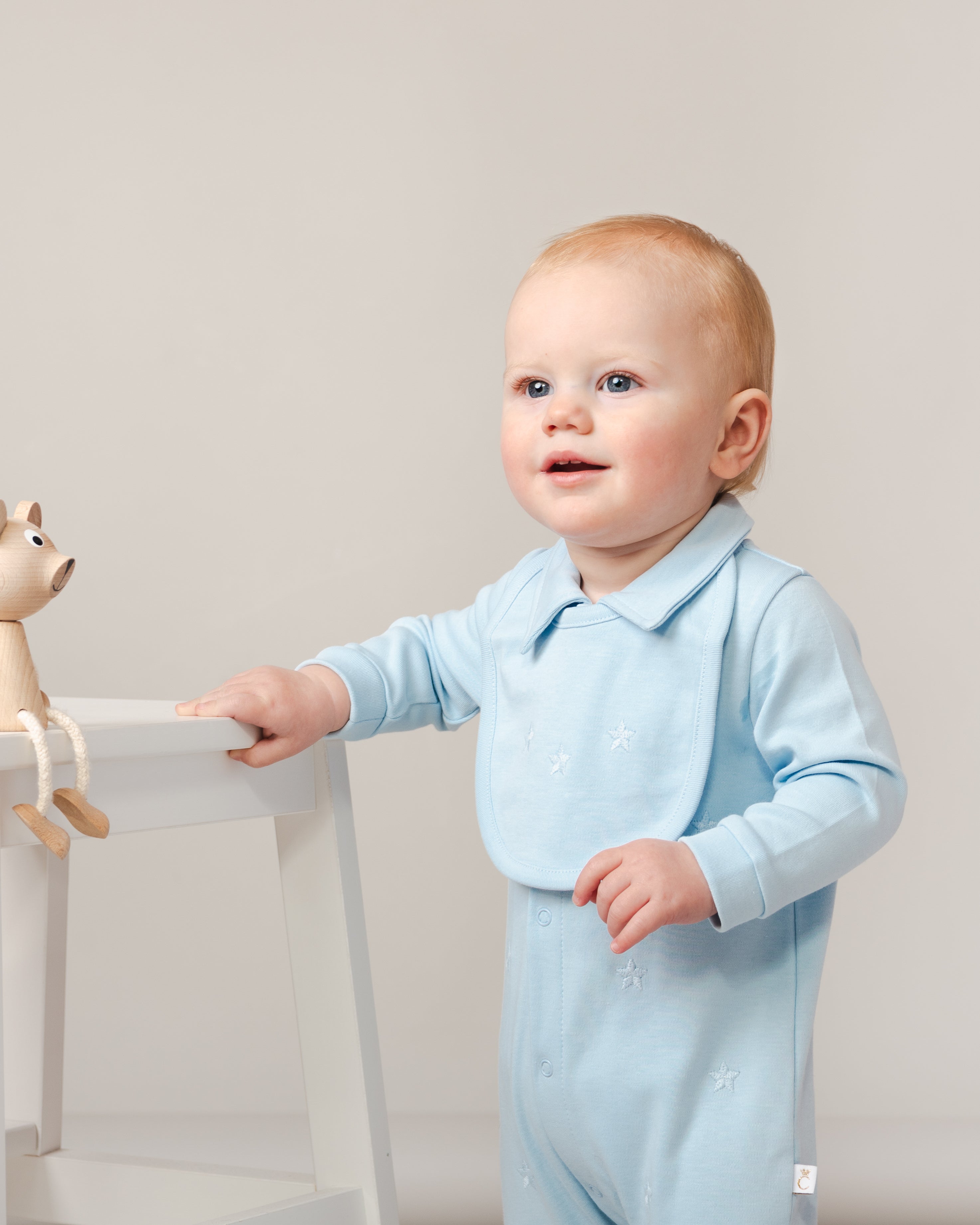 Sky Blue Baby Romper with Embroidered Stars and Matching Bib