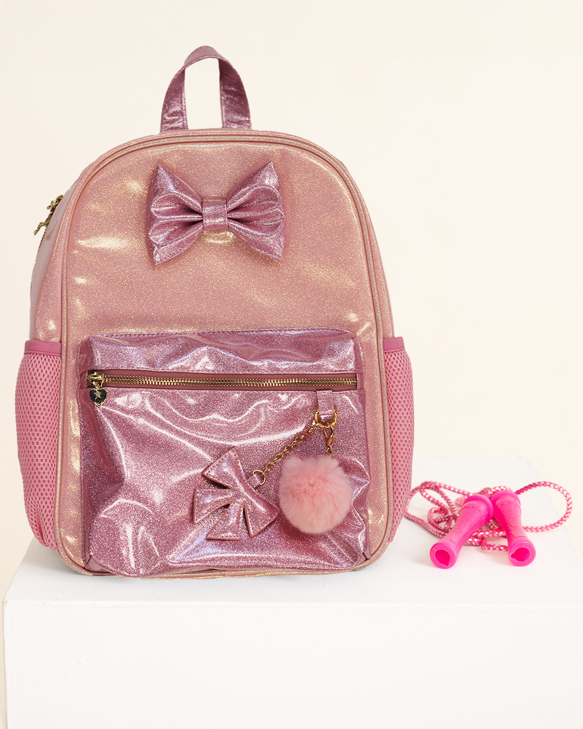 Pink Shimmer Bow Backpack with Charms